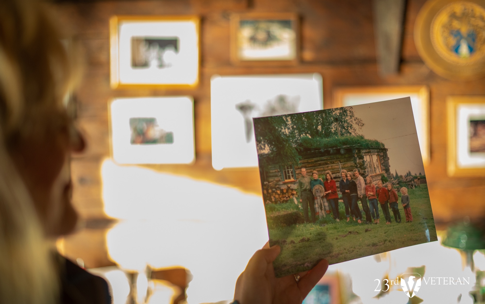 A historic family photograph held inside a homestead cabin