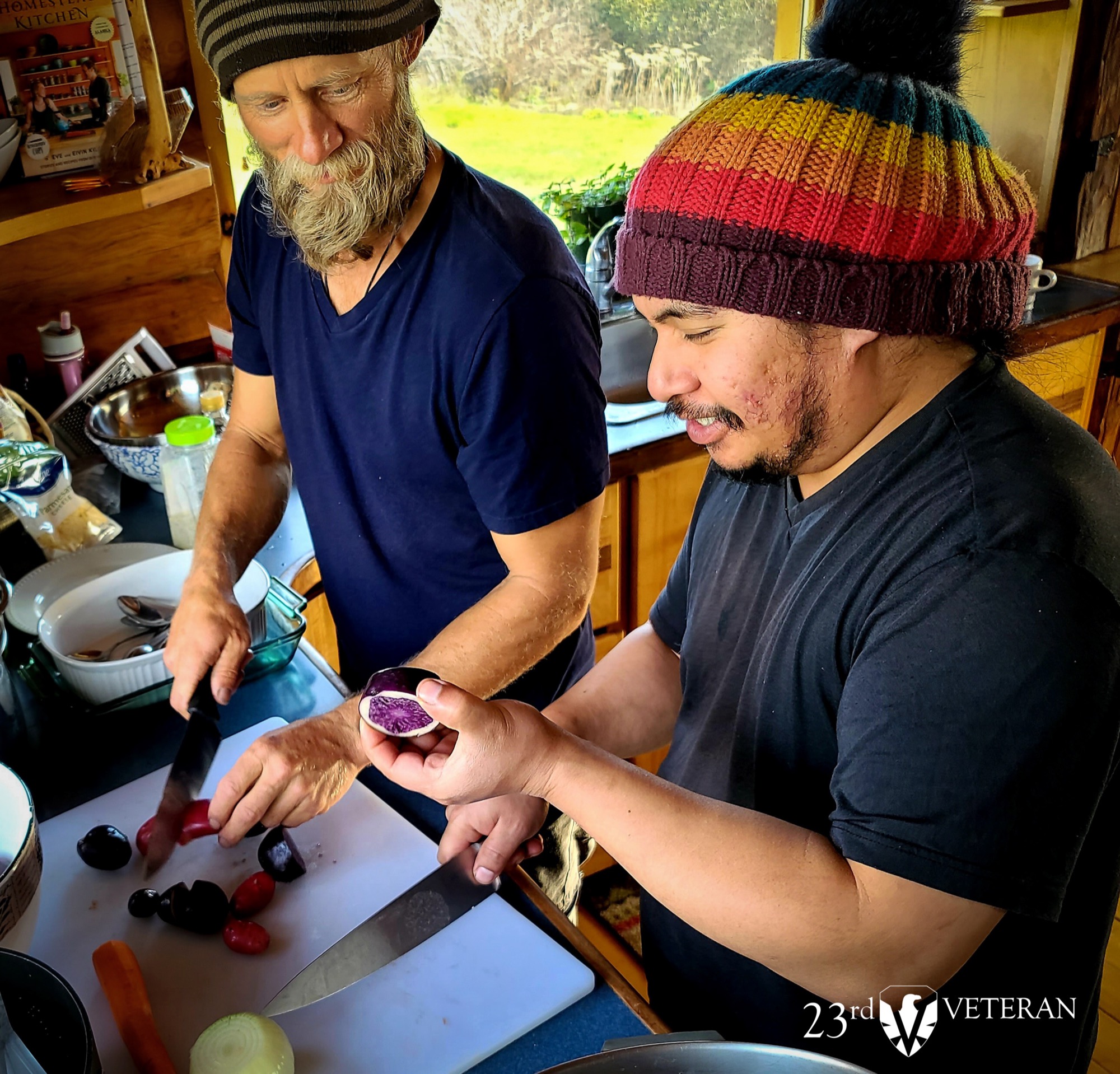 Retreat participants preparing food together in a homestead kitchen